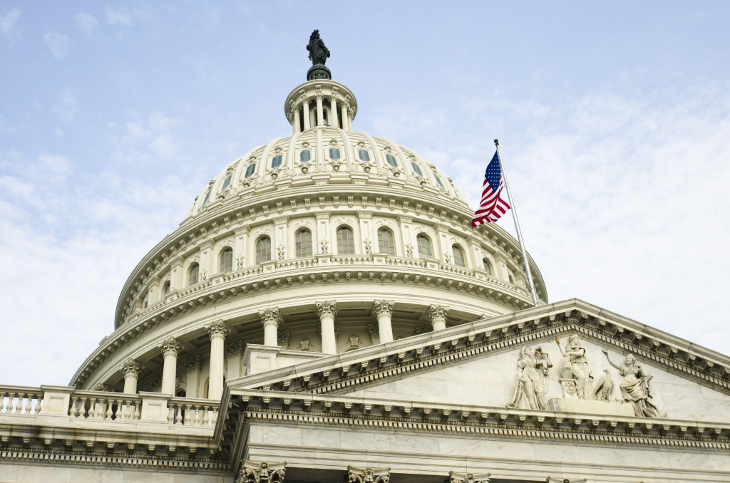 Close up Angle of Capitol Building with American Flag