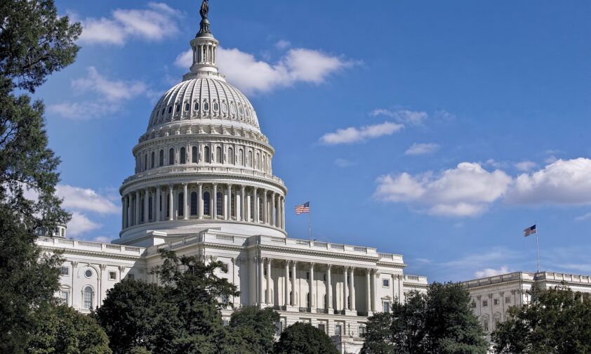 Medium Shot of Capitol Building with American Flag