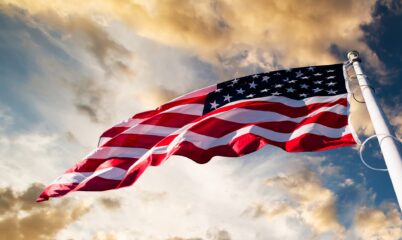 American Flag Flying with Sky Backdrop