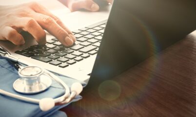 Doctor on Computer with Stethoscope