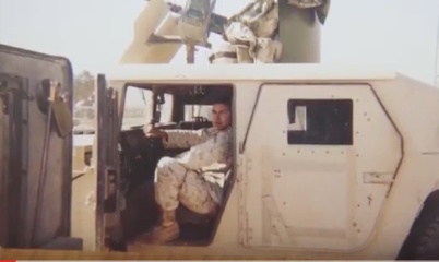 Soldier in Humvee, Sandy Background