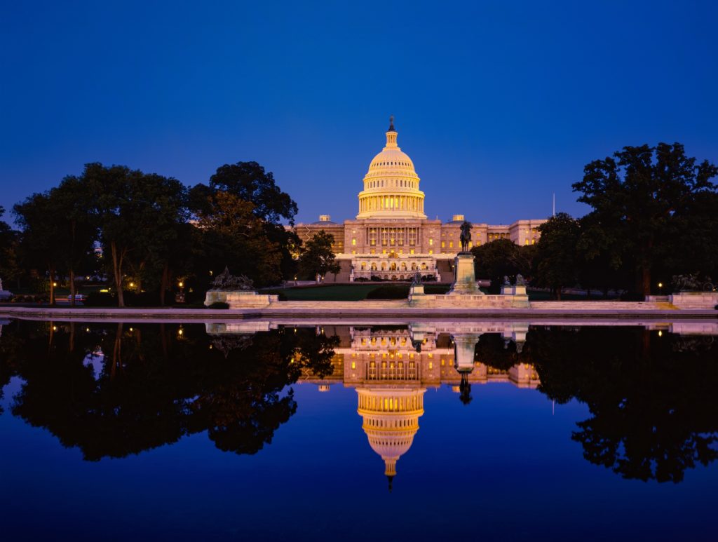 Capitol building with reflections at dusk