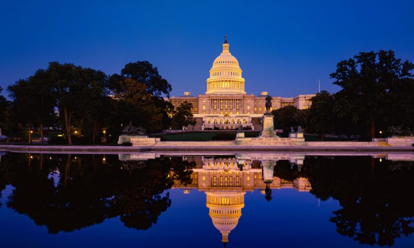 Capitol building with reflections at dusk
