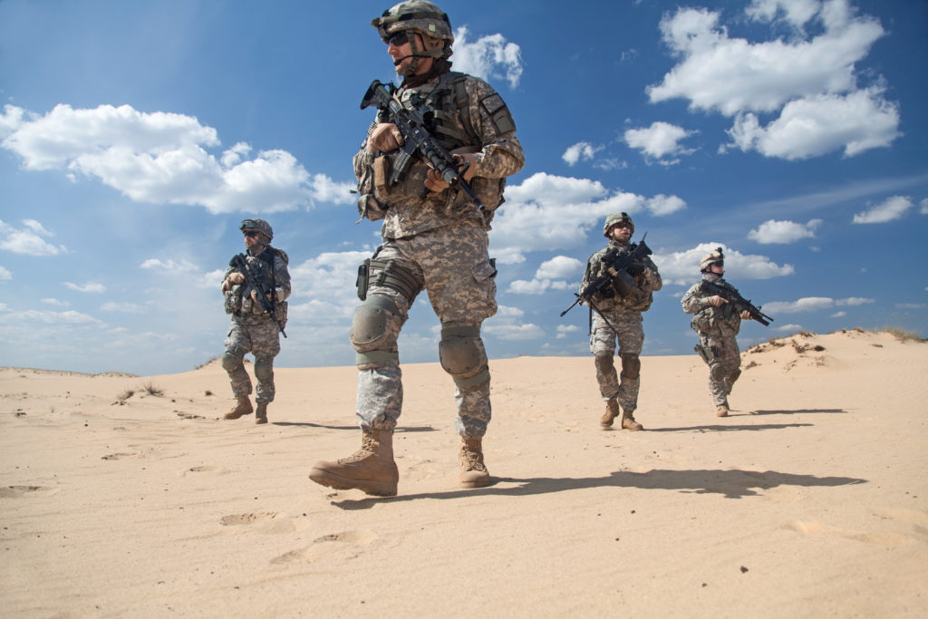 4 Soldiers on Patrol with Desert Background