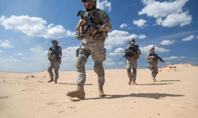 4 Soldiers on Patrol with Desert Background