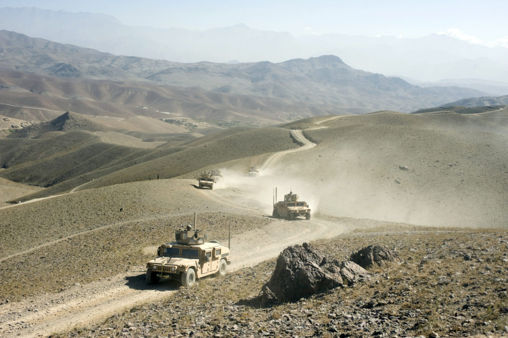 American Humvees driving Down Dunes