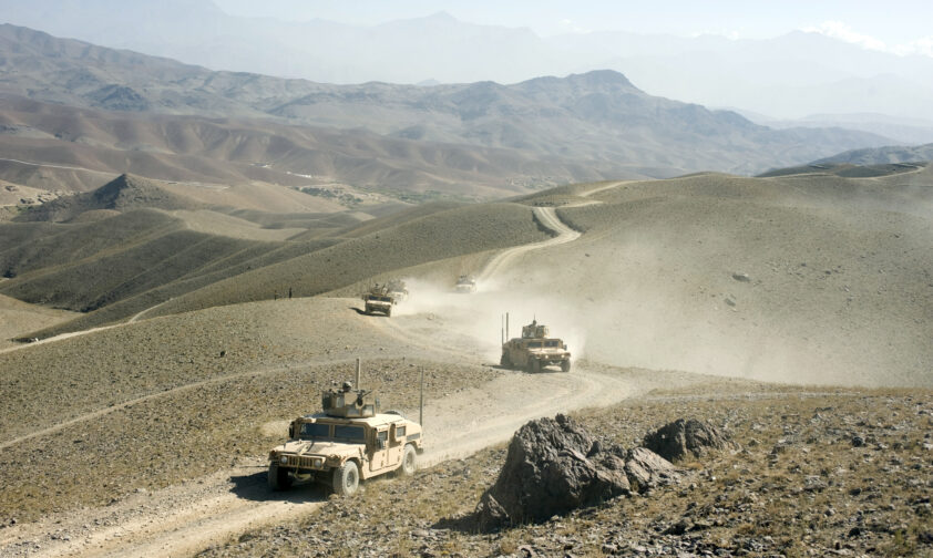 American Humvees driving Down Dunes