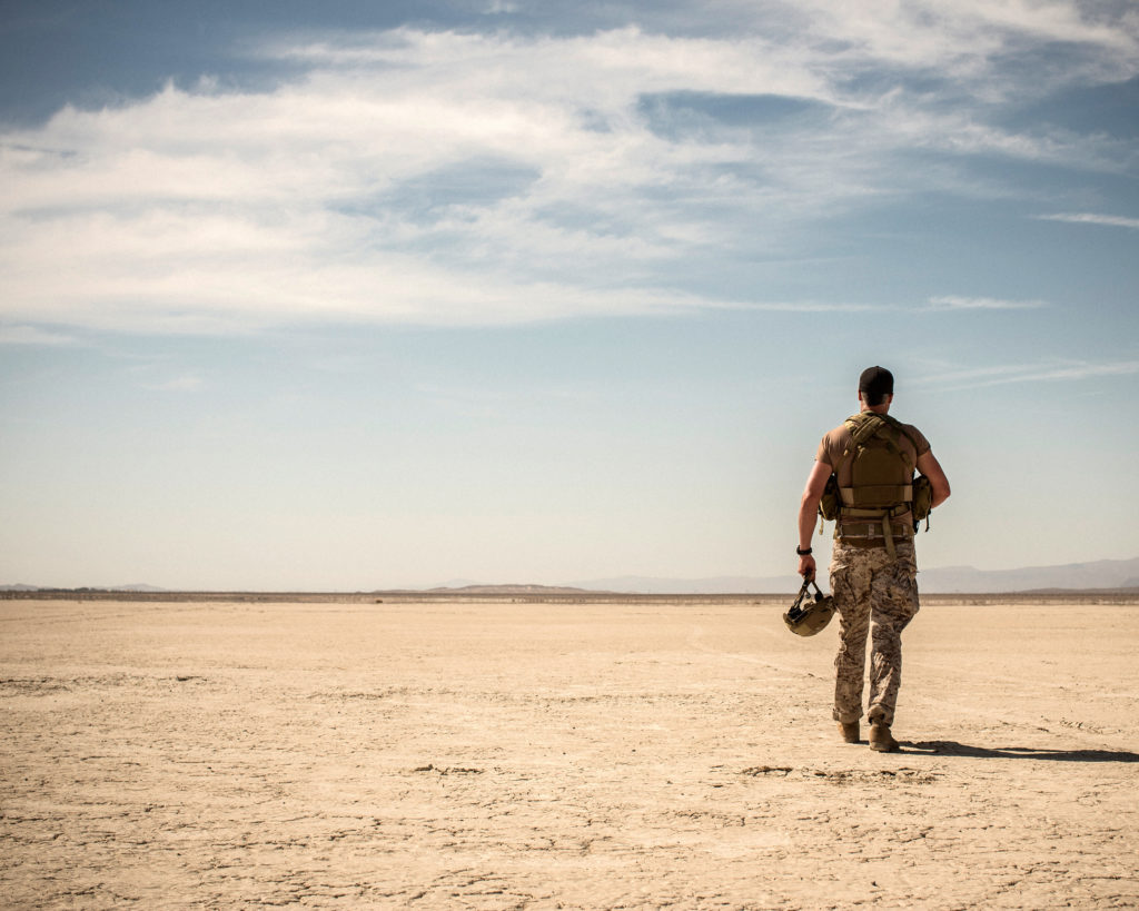 Soldier Walking Across Desert