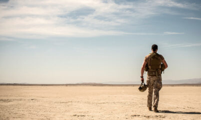 Soldier Walking Across Desert