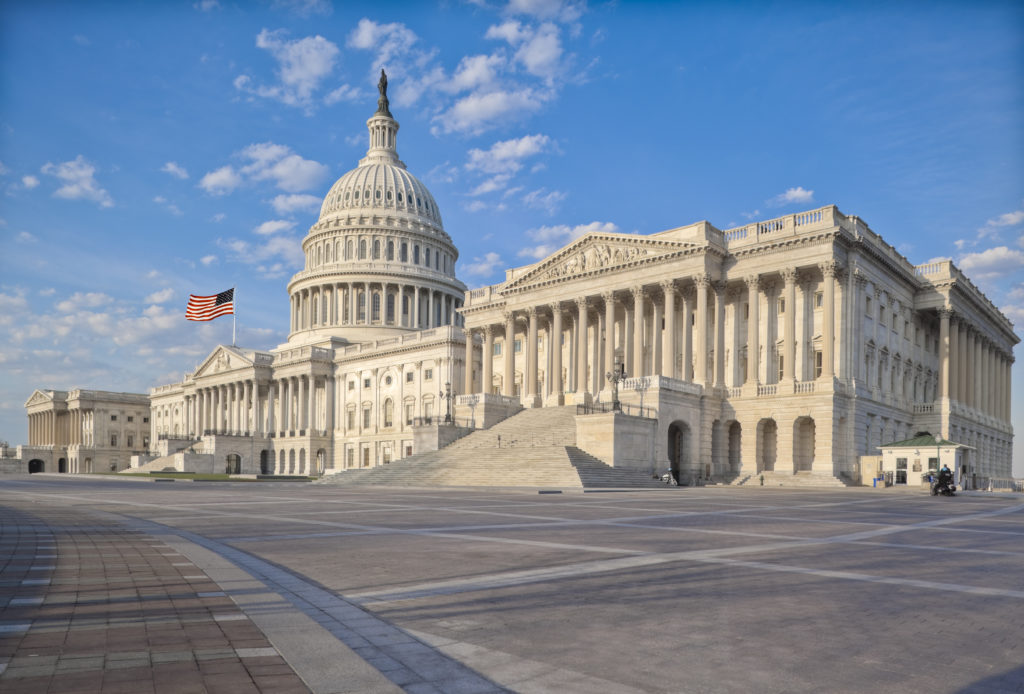 Wide Shot of Capitol Building and American Flag