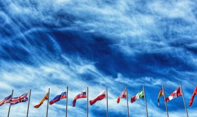 World Flags flying with Turbulent Clouds in Background