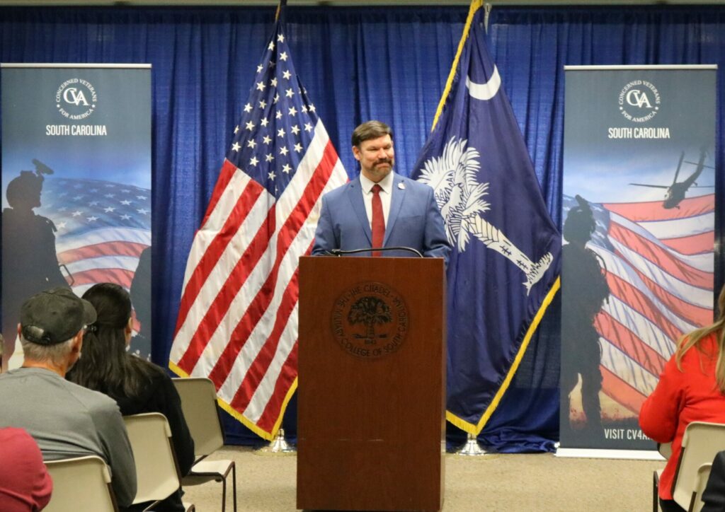 Frank Bullock standing behind podium