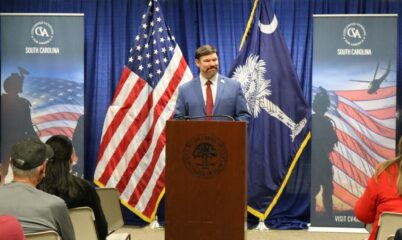 Frank Bullock standing behind podium