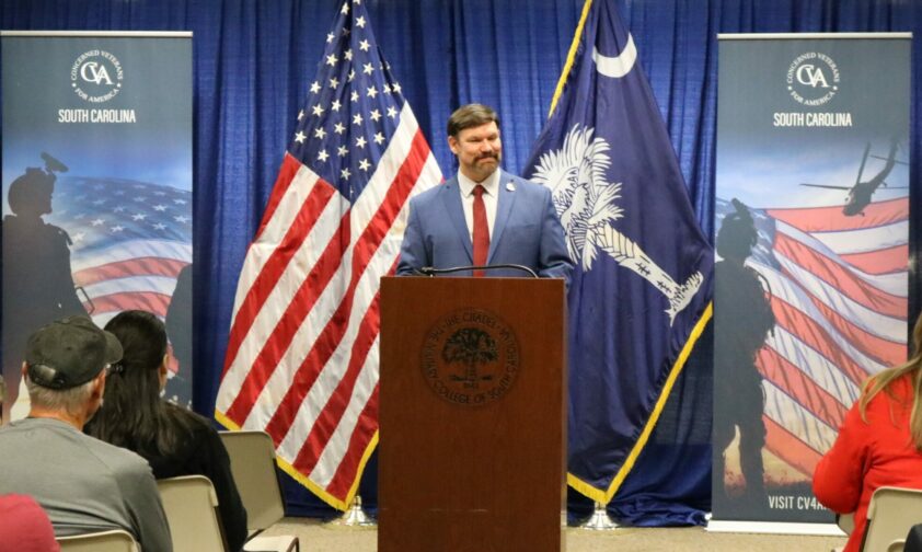 Frank Bullock standing behind podium