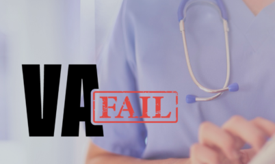 Dr. looking at records w dark VA fail logo